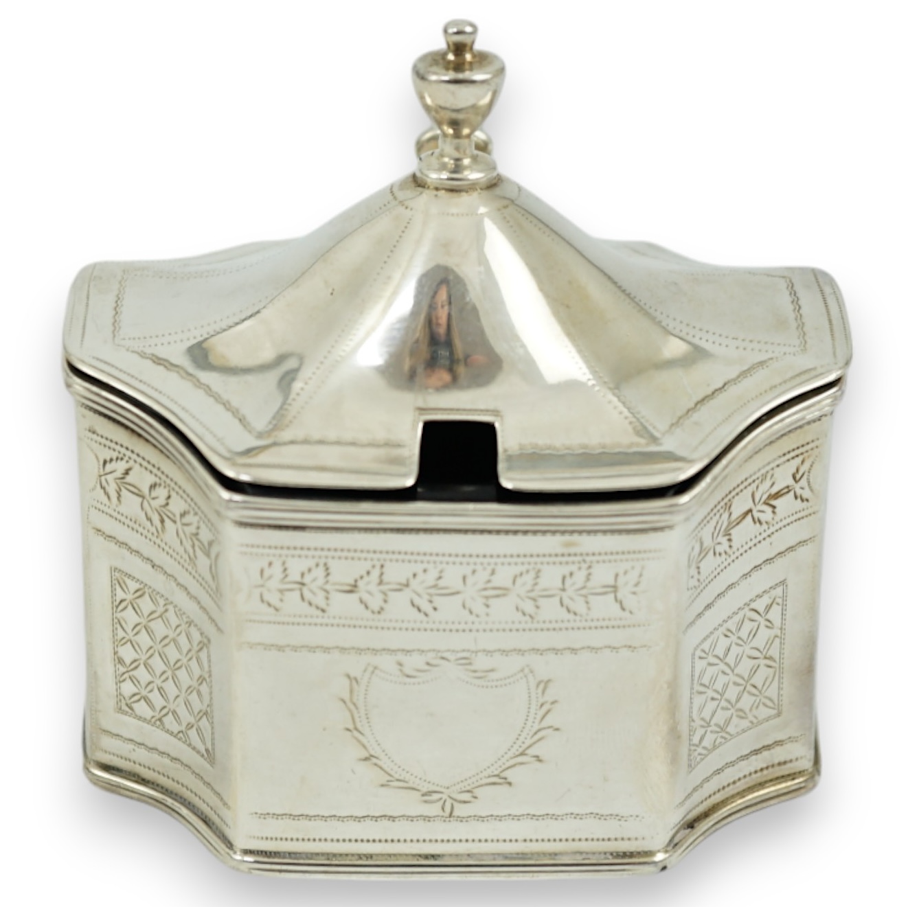 A George III silver mustard pot, with inverted angles and blue glass liner, Alexander Field, London, 1803, height 85mm.